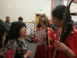 Jenny talking to musicians